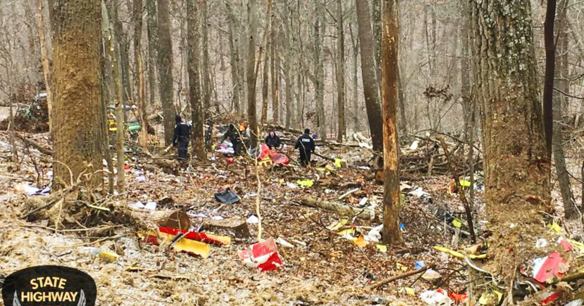 In this photo provided by the Ohio State Highway Patrol, authorities survey the scene of wreckage where a medical helicopter crashed in a remote wooded area in Brown Township, Ohio, on its way to pick up a patient, Jan. 29, 2019. (Ohio State Highway Patrol via AP)