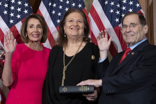 Speaker of the House Nancy Pelosi performs a ceremonial swearing-in