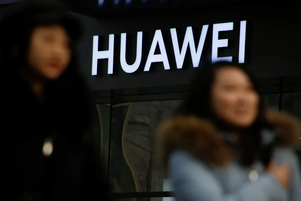A woman walks past a Huawei shop in Beijing on Jan. 29, 2019. (Thomas Peter/Reuters)