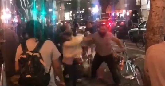 Man Seen in Video Punching Two Women Surrenders to Police