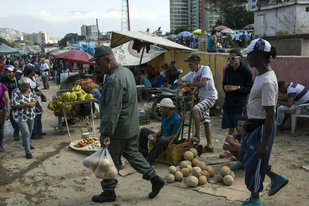 Workers and customers gather at a wholesale food market in Caracas, Venezuela, on Jan. 28, 2019. (Rodrigo Abd/AP Photo)