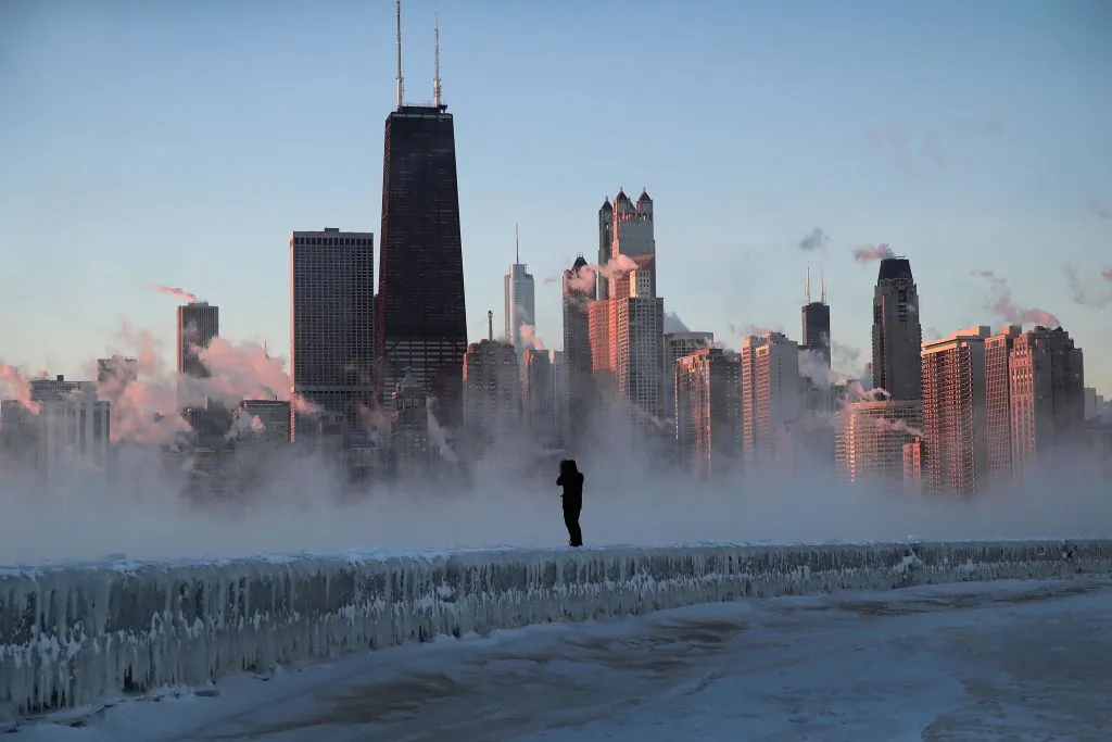 A man walks along an ice-covered break-wall along Lake Michigan while temperatures hovered around -20 degrees and wind chills neared -50 degrees on Jan. 31, 2019, in Chicago, Illinois. (Scott Olson/Getty Images)