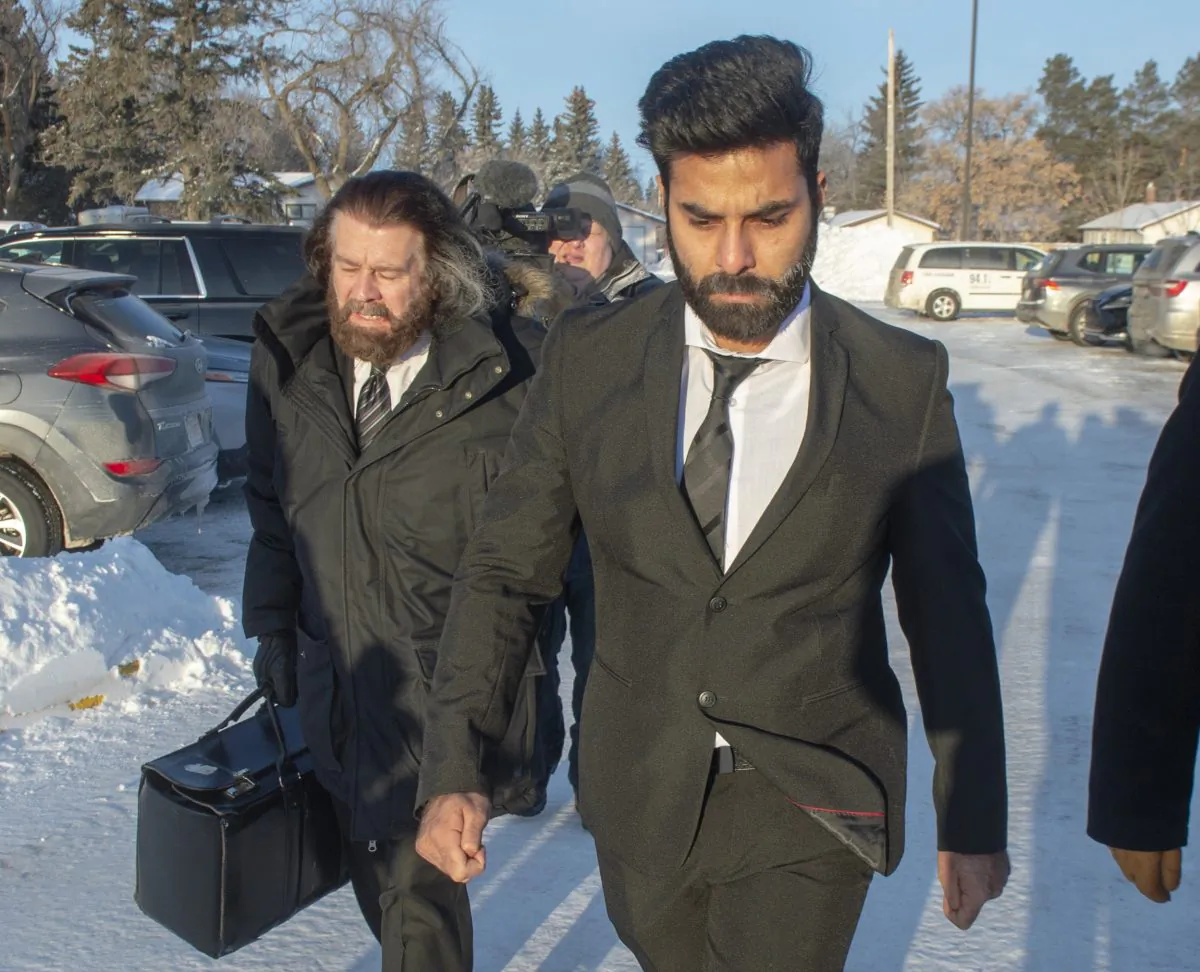 Jaskirat Singh Sidhu, right, the driver of the truck that struck the bus carrying the Humboldt Broncos hockey team, arrives with his lawyer Mark Brayford for the third day of his sentencing hearing in Melfort, Sask, on Jan. 30, 2019. (The Canadian Press/Ryan Remiorz)
