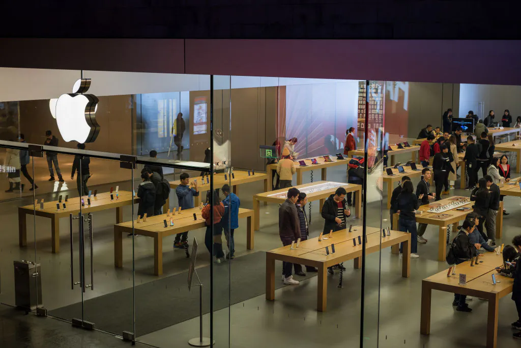 Customers browse inside an Apple store in Shenzhen, China, on Jan. 3, 2019. (Billy H.C. Kwok/Getty Images)