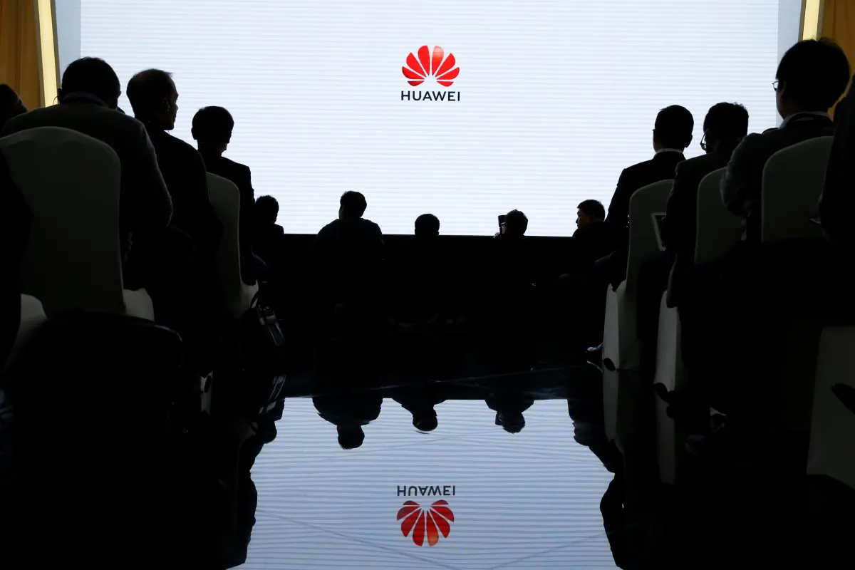 People attend a product presentation at Huawei in Beijing on Jan. 24, 2019.   (Reuters/Thomas Peter)