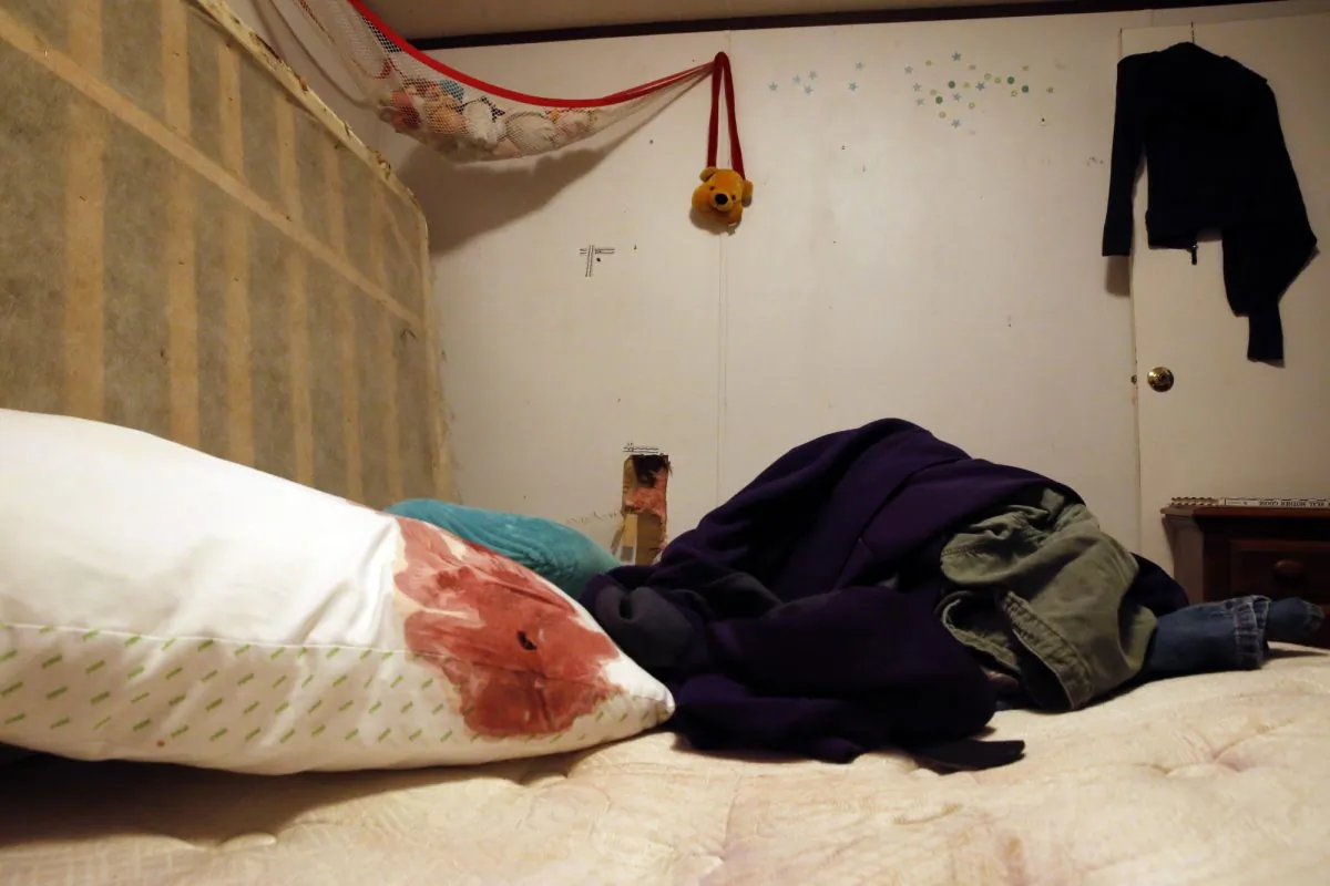 Blood and bullet holes are seen in the bedroom where Keith and wife Elizabeth Theriot were killed in the Louisiana suburb of Gonzales, Va.,  on Jan 27, 2019.(AP Photo/Gerald Herbert)