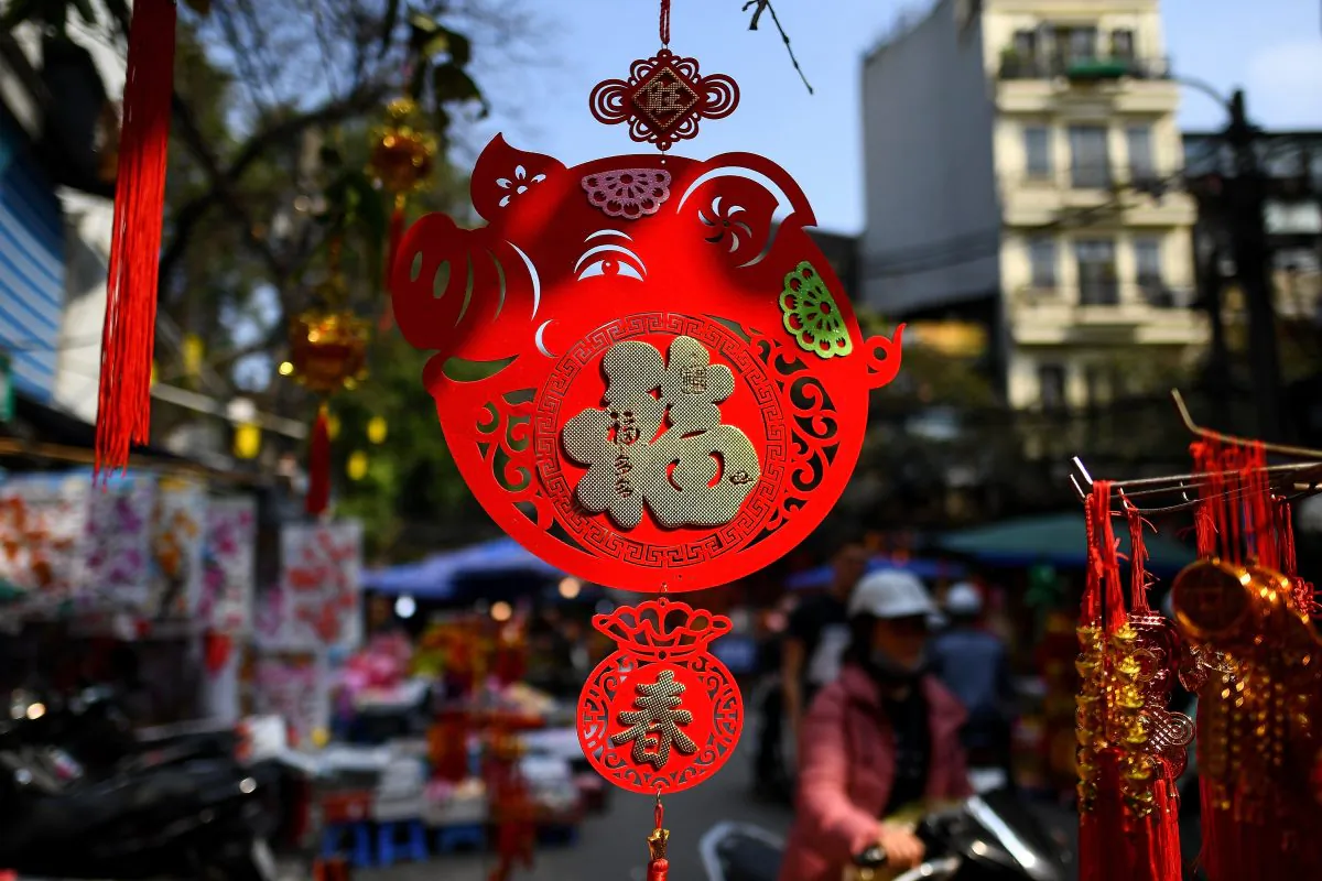 A "pig" shaped decoration hangs outside a shop at a market in the old quarters of Hanoi on Jan. 28, 2019 ahead of the Lunar New Year. (Manan Vatsyayana/AFP/Getty Images)