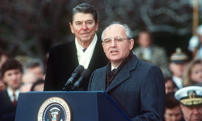 President Ronald Reagan (L) with Soviet leader Mikhail Gorbachev during welcoming ceremonies at the White House on the first day of their disarmament summit, on Dec. 8, 1987. (Jerome Delay/AFP/Getty Images)