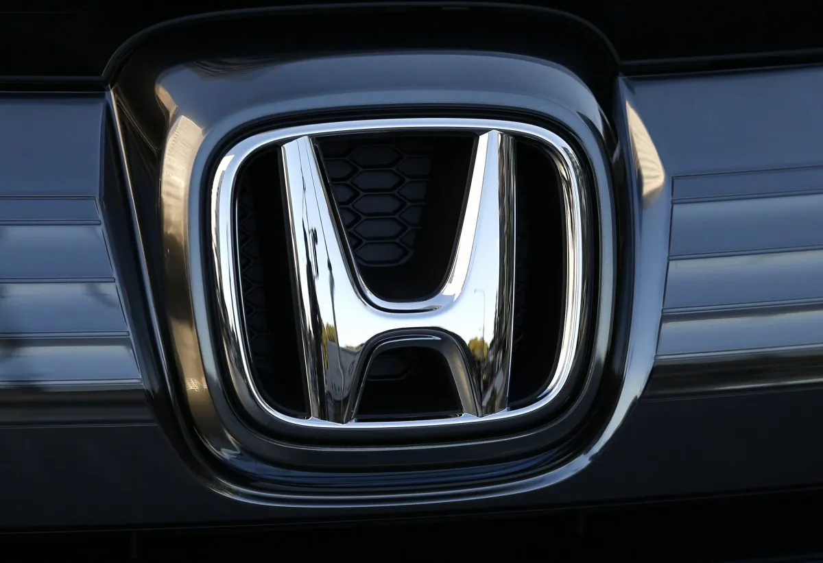 In this Jan. 11, 2016, file photo, the logo of Honda Motor Co. is seen on a Honda vehicle at the Japanese automaker's headquarters in Tokyo. (Shuji Kajiyama/AP)