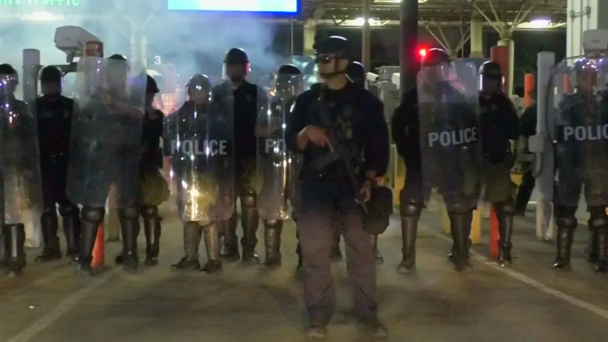 Officer in riot gear at border crossing area in Tijuana, Mexico, on Jan. 31, 2019. (Screenshot/Reuters)