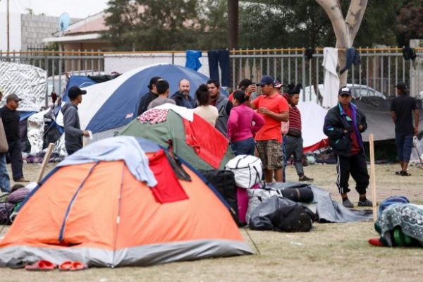 Members of the Central American migrant caravan camp out