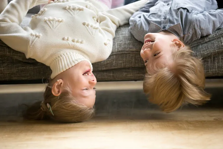 Researchers observed pairs of siblings to gain insight into how humor develops during childhood. (fizkes/Shutterstock)