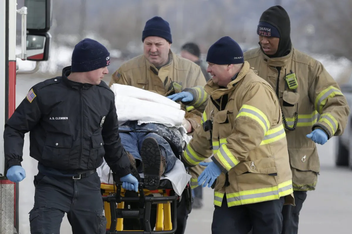 First responders evacuate a person found in sub-freezing temperatures on the banks of Carter Lake, in Omaha, Neb., on Jan. 30, 2019. (Nati Harnik/AP)