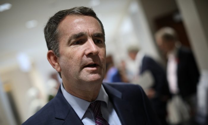 Virginia Gov. Ralph Northam, during a campaign stop at the All Dulles Area Muslim Society in 2017, is facing calls to resign after a picture showing him in blackface or a KKK outfit emerged on Feb. 1, 2019. (Win McNamee/Getty Images)