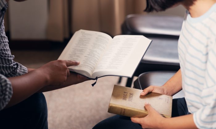 Pictured are students studying the Bible. (Shutterstock/ palidachan)