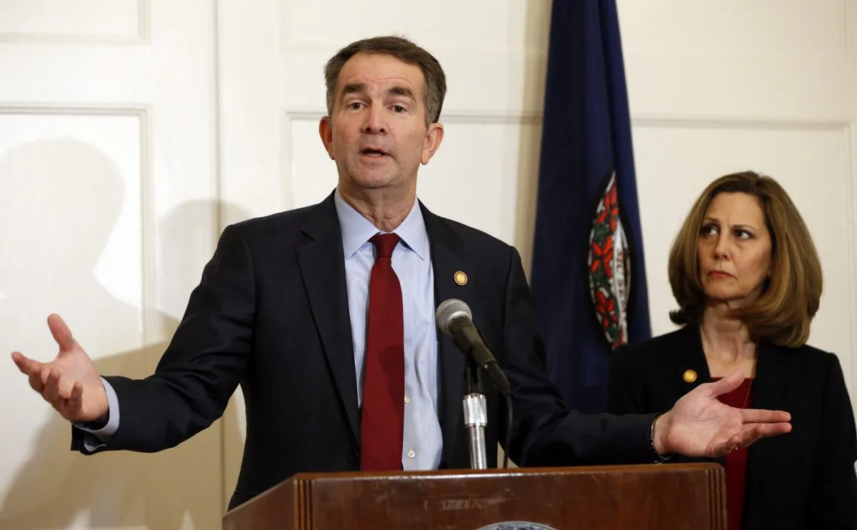 Virginia Gov. Ralph Northam, left, accompanied by his wife, Pam, speaks during a news conference in the Governor's Mansion in Richmond, Va., on Feb. 2, 2019. (AP Photo/Steve Helber)