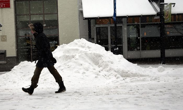 A woman walks down a street during heavy snow on Feb. 5, 2014, in Burlington, Vt. (Spencer Platt/Getty Images)