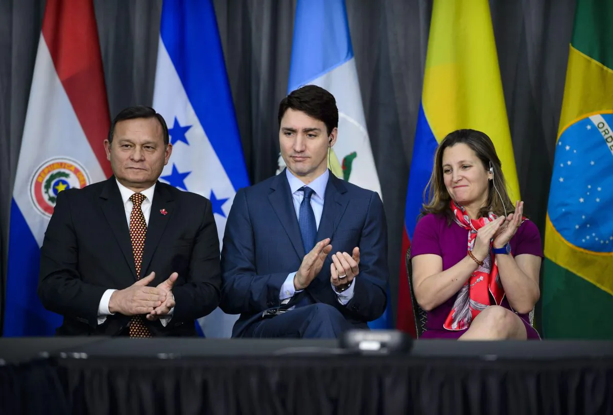 Peru's Minister of Foreign Affairs Nestor Francisco Popolizio Bardales (L), Prime Minister Justin Trudeau, and Minister of Foreign Affairs Chrystia Freeland at the opening session of the 10th ministerial meeting of the Lima Group in Ottawa on Feb. 4, 2019. (The Canadian Press/Sean Kilpatrick)