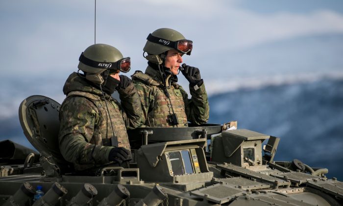 Spanish soldiers in a tank during an exercise to capture an airfield as part of the Trident Juncture 2018, a NATO-led military exercise, near the town of Oppdal, Norway, on Nov. 1, 2018 (JONATHAN NACKSTRAND/AFP/Getty Images)