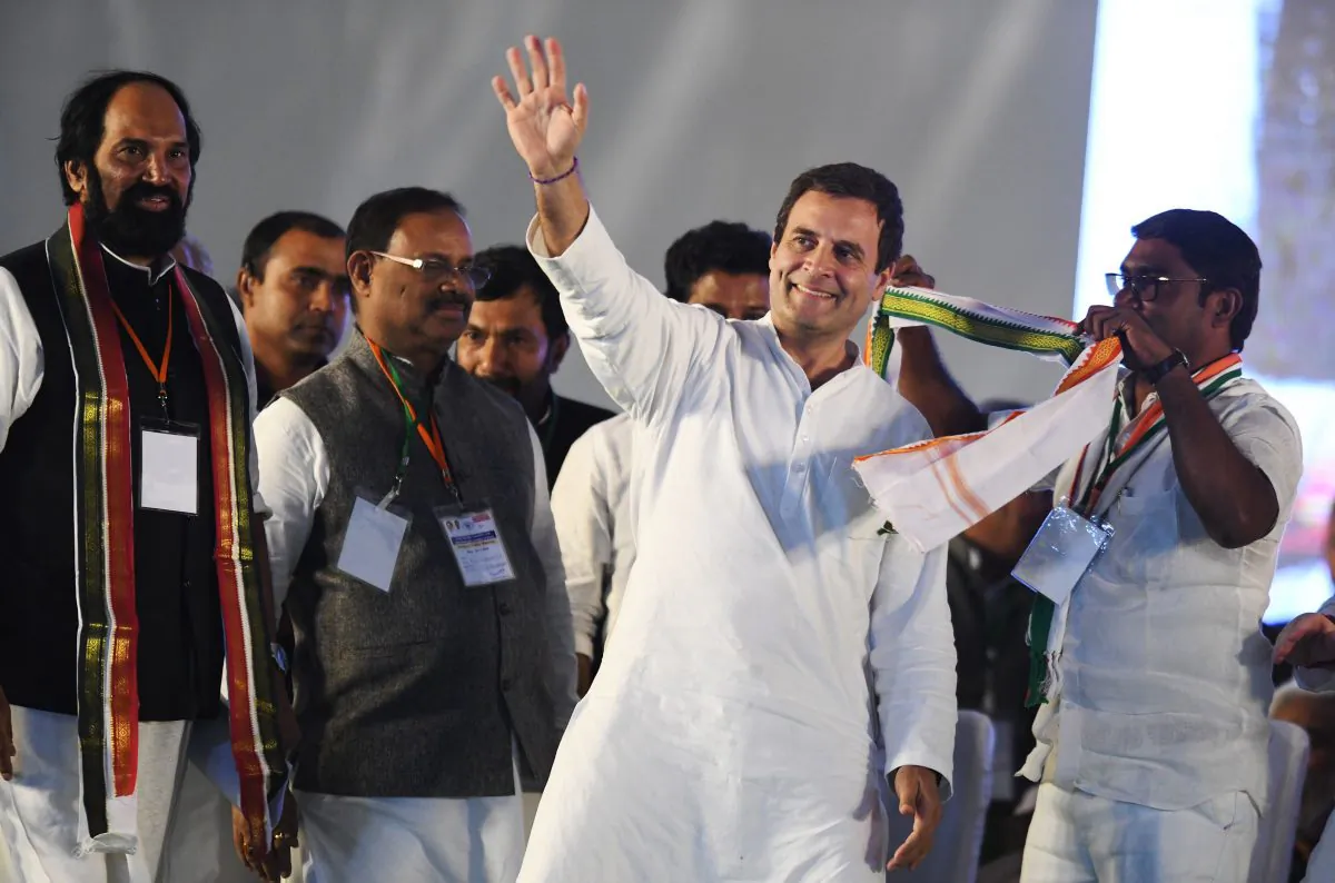 Indian National Congress President Rahul Gandhi waves during a public meeting for a state assembly election campaign in the Medchal constituency on Nov. 23, 2018. (Noah Seelam/AFP/Getty Images)