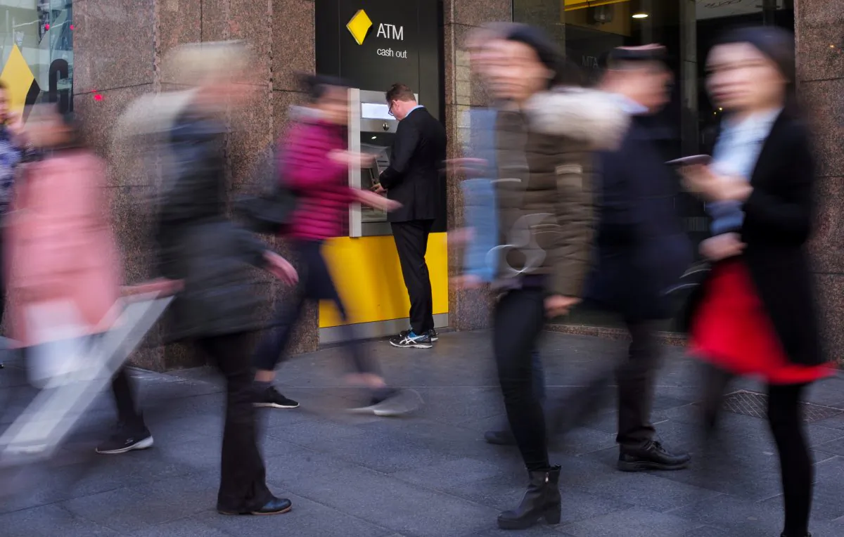 A man banks at a Commonwealth Bank automatic teller machine in Sydney, Australia, Aug. 28, 2017. (Reuters/Jason Reed)