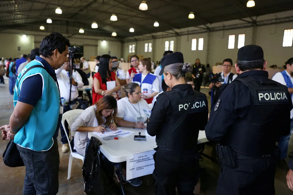 A police officer casts his vote at a polling station during the presidential election in San Salvador, El Salvador Feb. 3, 2019. (Reuters/Victor Pena)