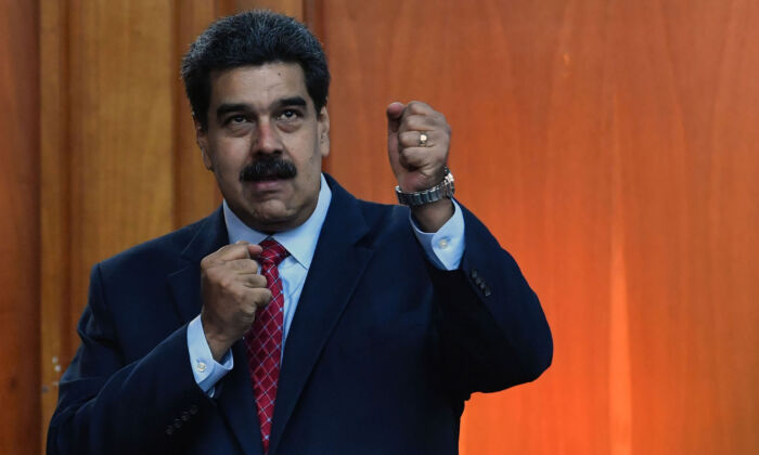 Venezuela's President Nicolas Maduro leaves after offering a press conference in Caracas, on Jan. 25, 2019. (Yuri Cortez/AFP/Getty Images)