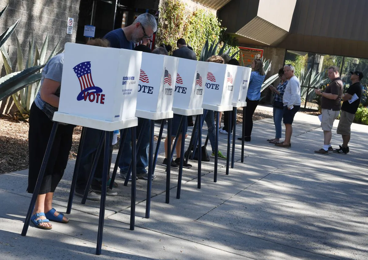 People vote at outdoor booths during early voting for the midterm elections in Pasadena, Calif., on Nov. 3, 2018. (Mark Ralston/AFP/Getty Images)