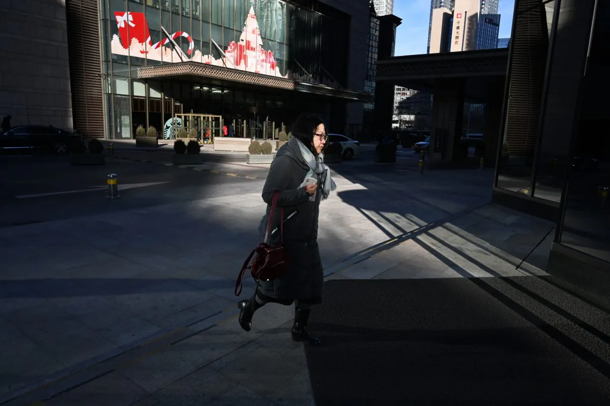 China's economy maybe worse than it presents. Half of Chinese didn't receive year-end bonuses before new year, some even were laid off. (GREG BAKER/AFP/Getty Images)