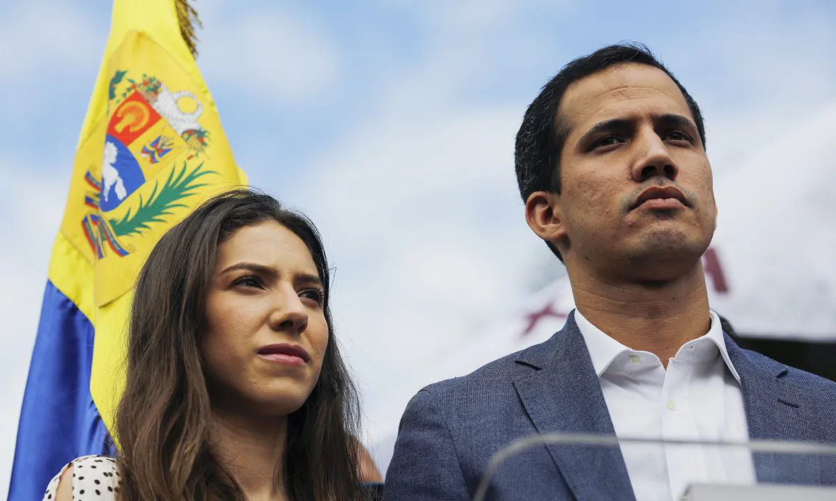 Opposition leader of Venezuela Juan Guaidó delivers a speech next to his wife Fabiana Rosales during a demonstration on January 26, 2019 in Caracas, Venezuela. (Marco Bello/Getty Images)