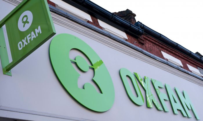 'Oxfam' signage is pictured outside a high street branch of an Oxfam charity shop in south London on February 17, 2018. JUSTIN TALLIS/AFP/Getty Images