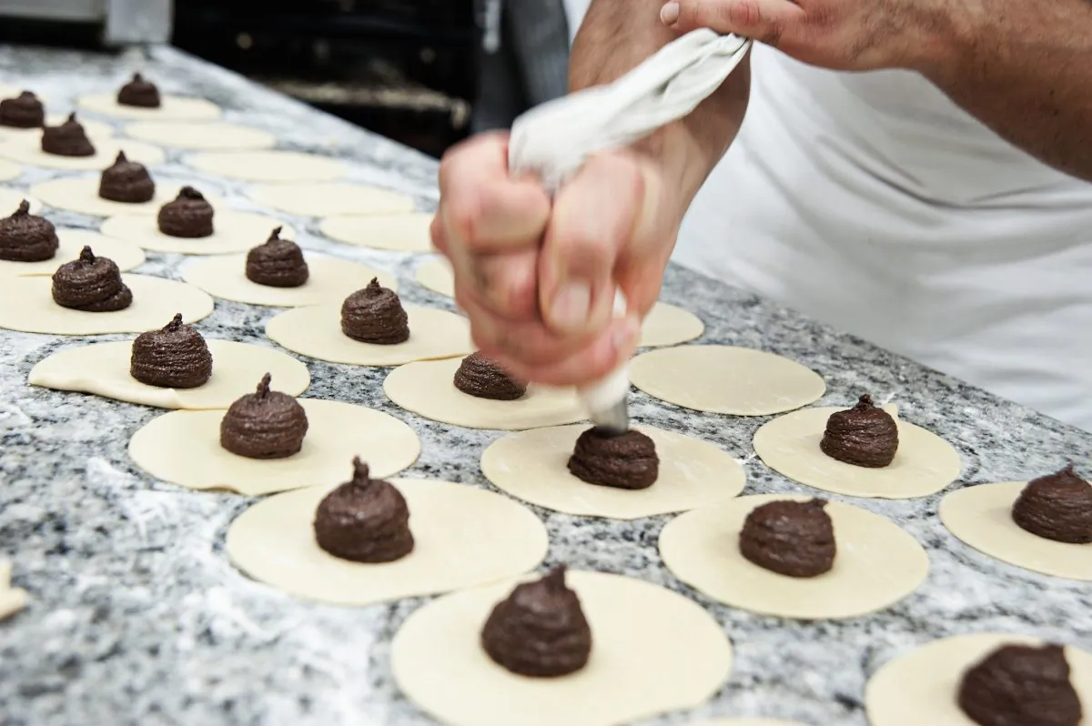 Making ‘mpanatiggi, Sicily's centuries-old chocolate meat pies. (Courtesy of L’Antica Dolceria Bonajuto)