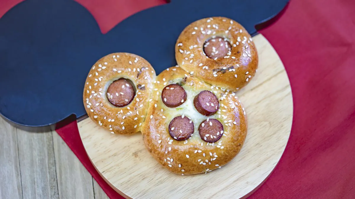 This undated photo provided by Disneyland Resort shows a Mickey Mouse-shaped Chinese hot dog bun from the Prosperity Bao & Buns marketplace at Disney California Adventure Park in Anaheim, Calif. (Disneyland Resort via AP)