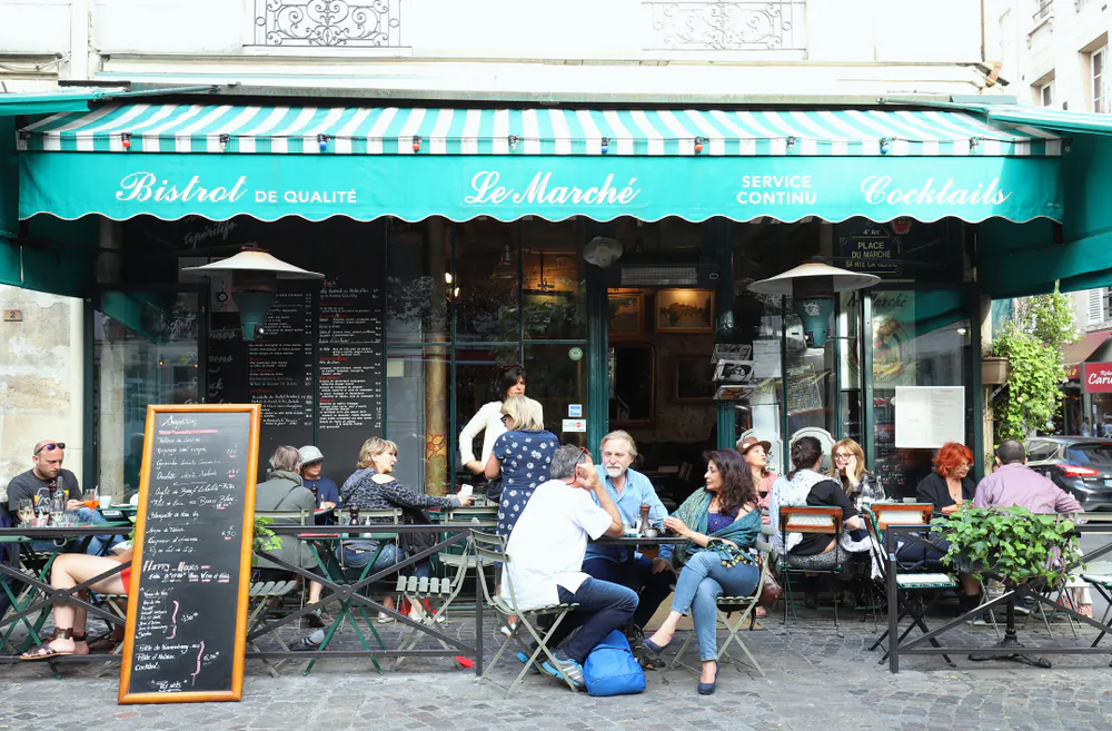 People from all walks of life gather at the city's bistros. (Shutterstock)