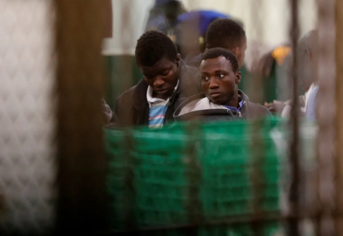 Migrants eat a meal at a refugee center for migrants who arrive from Spain in Bayonne, France, on Jan. 31, 2019. (Reuters/Regis Duvignau)