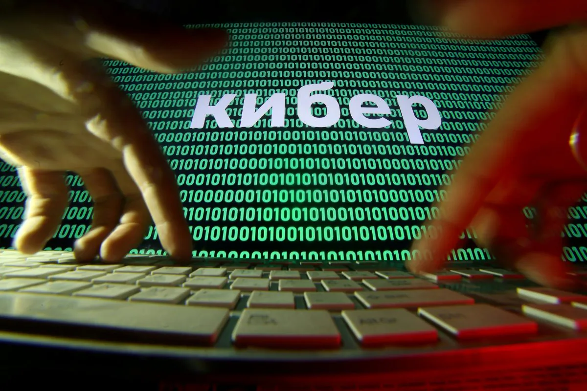 Hands on a keyboard in front of a displayed cyber code on Oct. 4, 2018. (Reuters/Dado Ruvic/Illustration/File Photo)