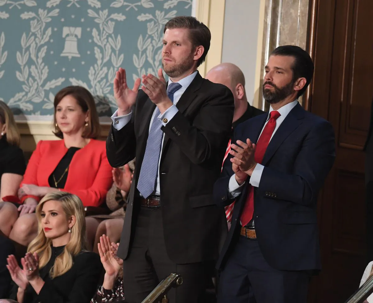Eric Trump (L) and Donald Trump, Jr., applaud as their father President Donald Trump delivers the State of the Union address before a Joint Session of Congress in Washington on Feb. 5, 2019. (Saul Loeb/AFP/Getty Images)
