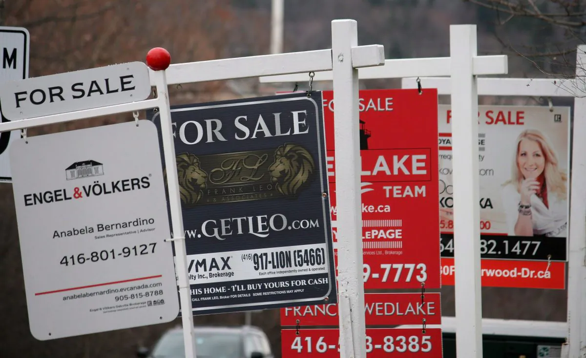 Real estate for sale signs are shown in Oakville, Ont. on Dec.1, 2018. The number of homes sold in Toronto and the surrounding area fell in 2018, along with the number of new listings hitting the market, as homebuyers and sellers grappled with a new reality of higher interest rates and stricter mortgage rules. (The Canadian Press/Richard Buchan)