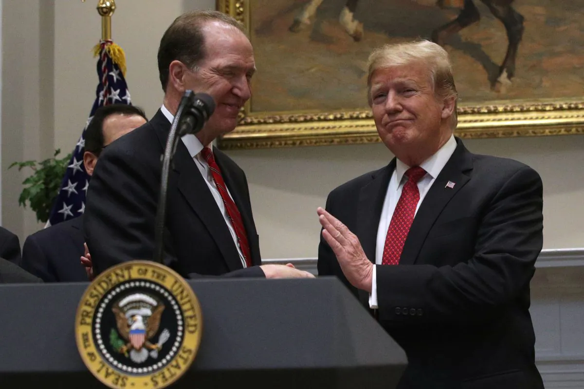 President Donald Trump shakes hands with Under Secretary of the Treasury for International Affairs David Malpass during a Roosevelt Room event at the White House on Feb. 6, 2019. (Alex Wong/Getty Images)