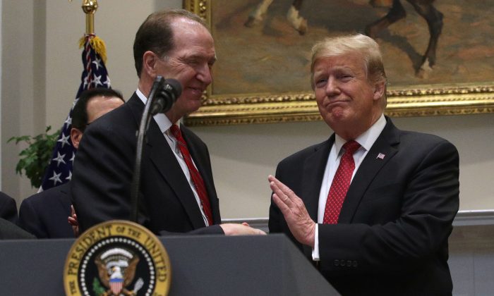 President Donald Trump shakes hands with Under Secretary of the Treasury for International Affairs David Malpass during a Roosevelt Room event at the White House on Feb. 6, 2019. (Alex Wong/Getty Images)