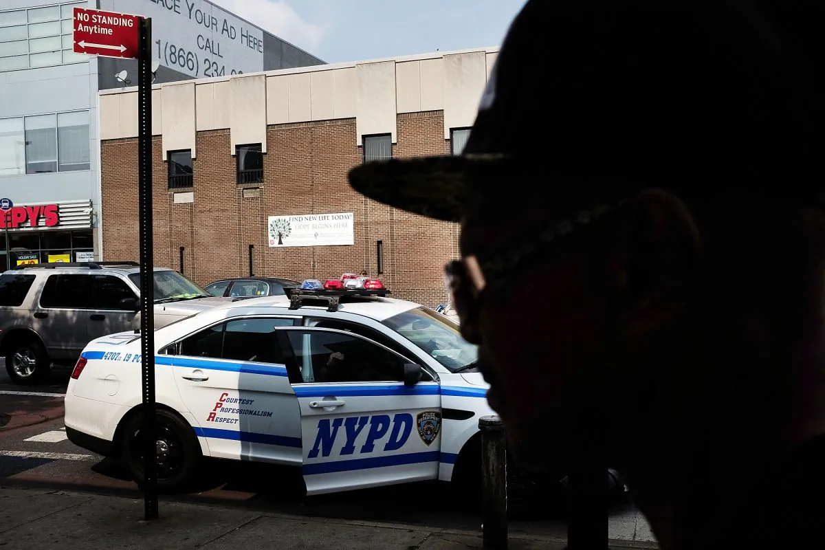 File photo of a New York Police Department police car patrolling an area that had witnessed an explosion in the use of K2 or "Spice," a synthetic marijuana drug, in East Harlem, New York City, on Sept. 2, 2015. (Spencer Platt/Getty Images)

