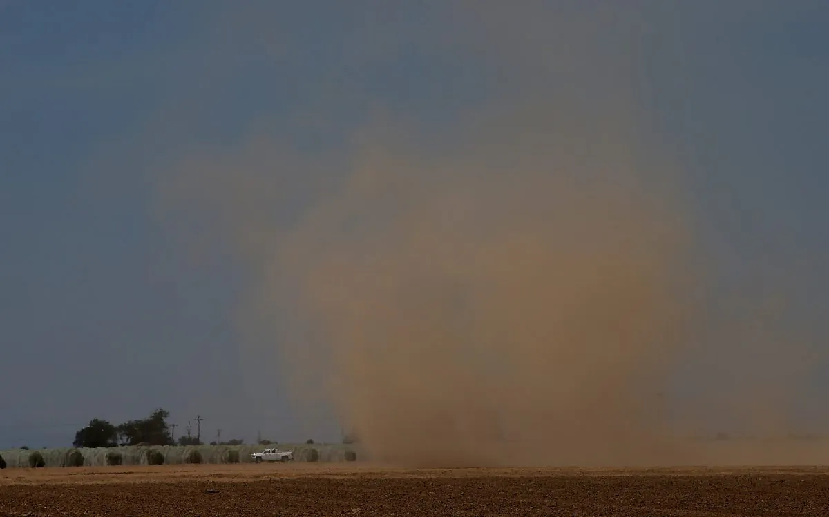 Dust over an empty field in Madera, Calif. on April 24, 2015. (Photo by Justin Sullivan/Getty Images)