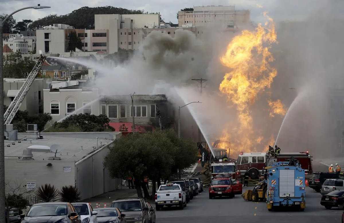 San Francisco firefighters battle a fire on Geary Boulevard in San Francisco, on Feb. 6, 2019. A gas explosion in a San Francisco neighborhood shot flames high into the air and was burning four buildings as utility crews scrambled to shut off the flow of gas. (Jeff Chiu/AP Photo)