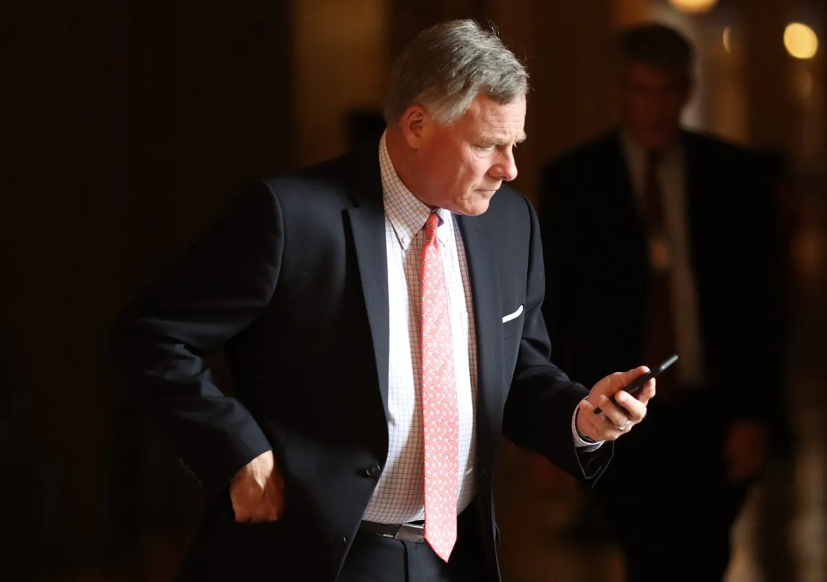 Sen. Richard Burr (R-NC) takes a phone call during the weekly Republican policy luncheon in Washington on Sept. 25, 2018. (Win McNamee/Getty Images)