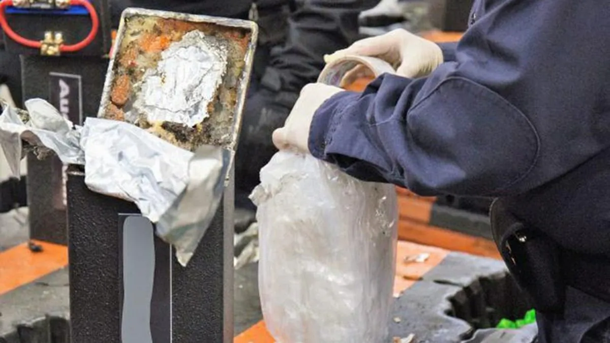 An officer extracting methamphetamine from a loudspeaker at the Los Angeles-Long Beach seaport on Jan. 11, 2019. (U.S. Customs and Border Protection via AP)