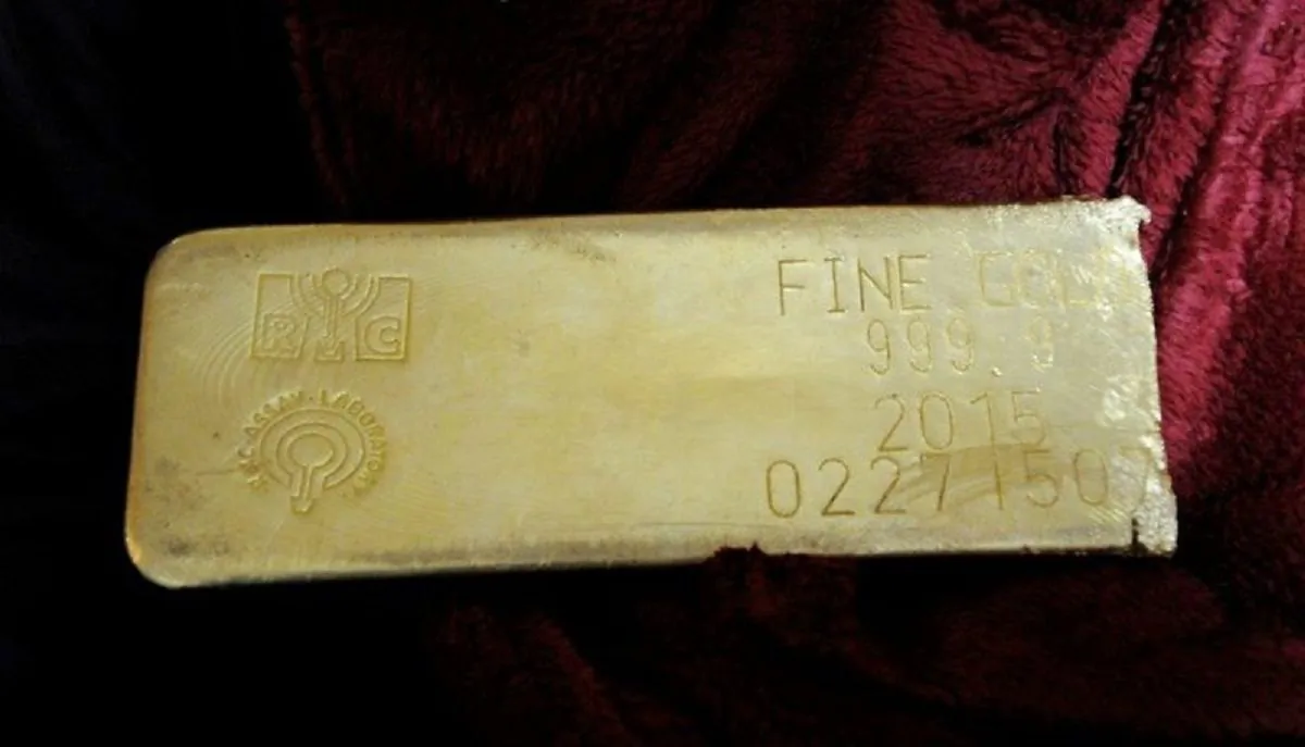 This undated file photo provided by the FBI shows a gold bar that was recovered in Miami from a heist in North Carolina on March 1, 2015. (FBI via AP, File)