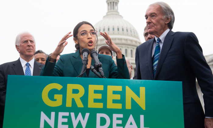 US Representative Alexandria Ocasio-Cortez, Democrat of New York, and US Senator Ed Markey (R), Democrat of Massachusetts, speak during a press conference to announce Green New Deal legislation to promote clean energy programs outside the US Capitol in Washington on Feb. 7, 2019. (Saul Loeb/AFP/Getty Images)