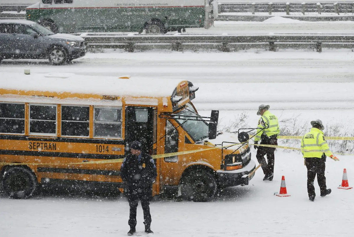 A person of interest was taken into custody after a school bus driver was shot where Interstate 35W and 94 run together near downtown Minneapolis, on Feb. 5, 2019. (Richard Tsong-Taatarii/Star Tribune via AP)