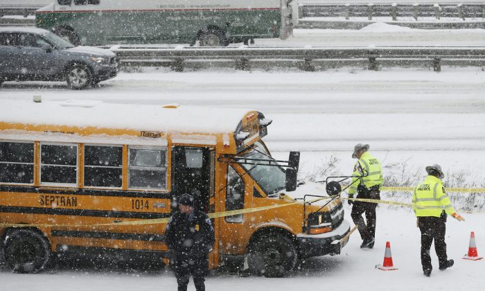 A person of interest was taken into custody after a school bus driver was shot where Interstate 35W and 94 run together near downtown Minneapolis, on Feb. 5, 2019. (Richard Tsong-Taatarii/Star Tribune via AP)