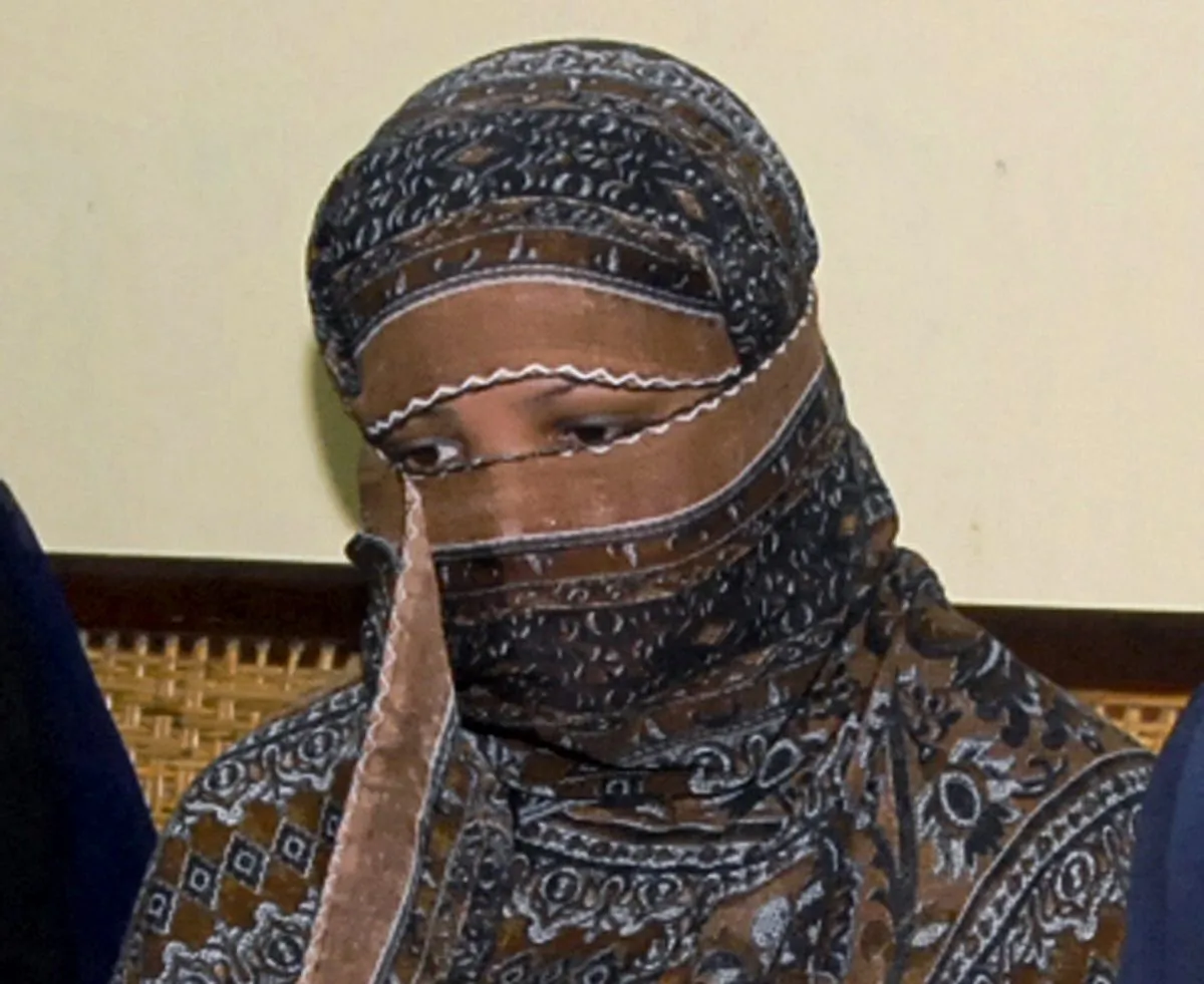 Asia Bibi, a Pakistani Christian woman, listens to officials at a prison in Sheikhupura near Lahore, Pakistan, on Nov. 20, 2010. (AP Photo, File)